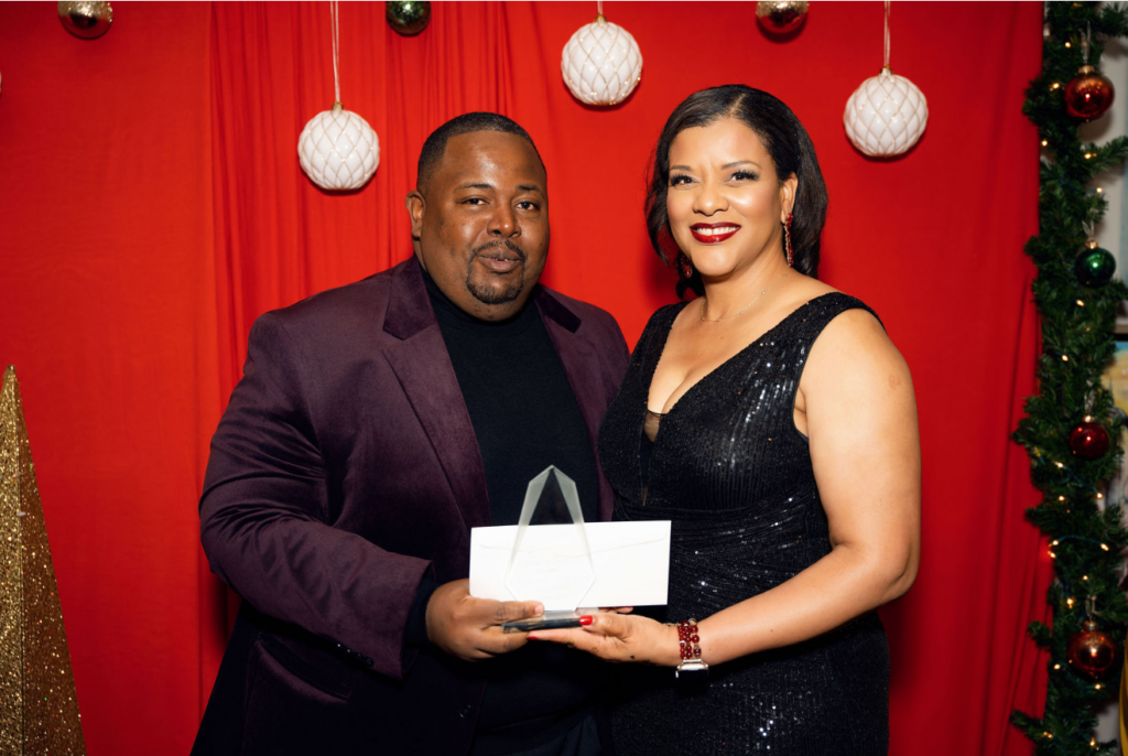 Franklyn Butler II presenting award to Charnette Thompson