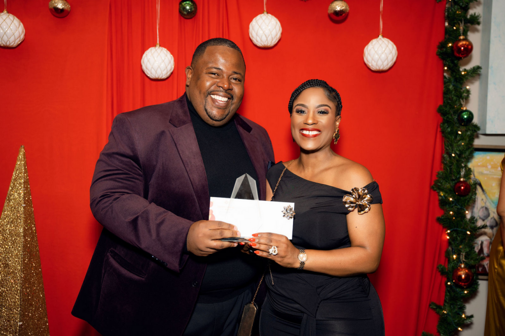 Franklyn Butler II presenting award to Sandia Miller